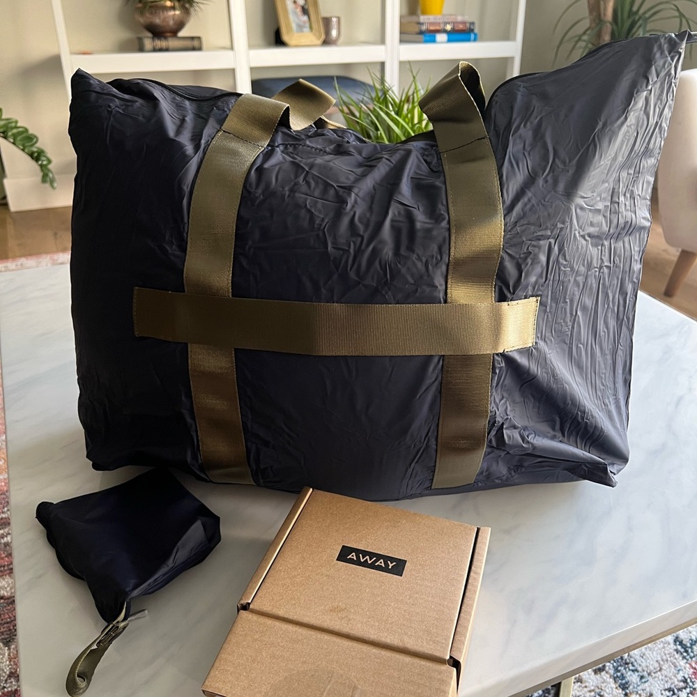 AWAY PACKABLE DUFFEL in Navy. Unopened. Ships in original box.